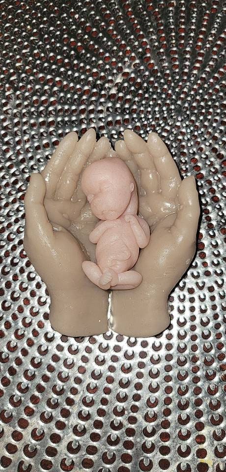 14 week gestation silicone memorial baby in silicone hands