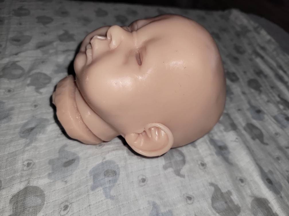 Silicone baby head and limbs by Terry quinn 19"