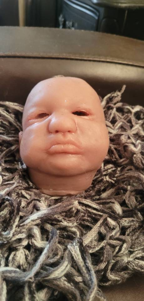 Silicone baby head by Donna kohn for 19" body