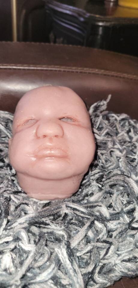 Silicone baby head by Donna kohn for 19" body