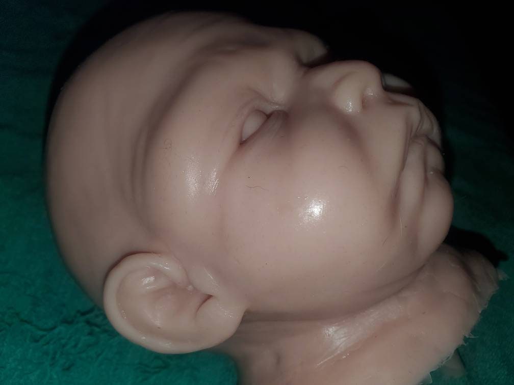Silicone baby head for cuddle body
