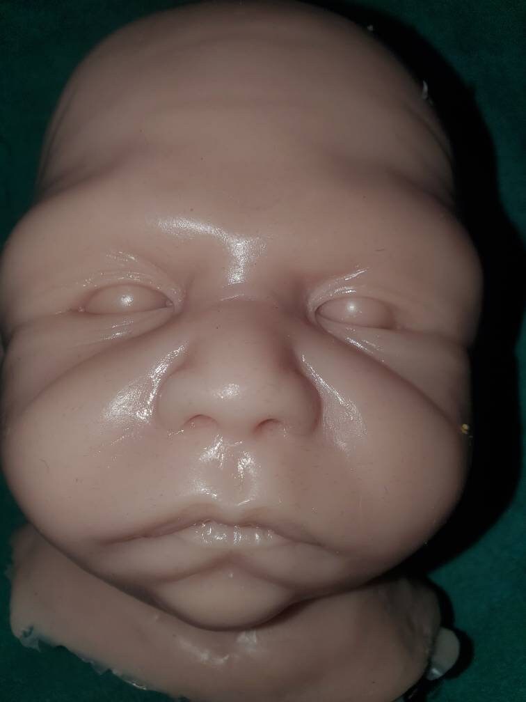 Silicone baby head for cuddle body
