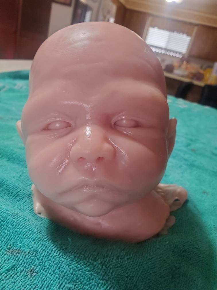 Silicone baby head for cuddle body