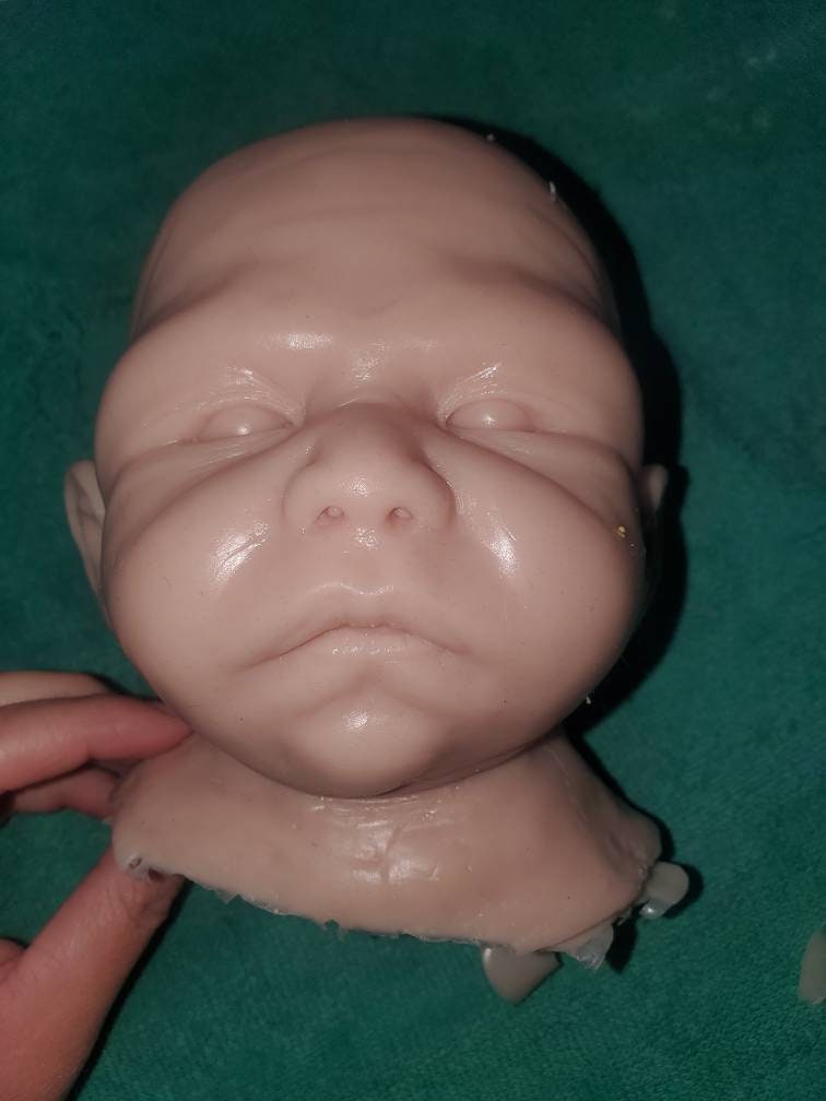 Silicone baby head for cuddle body