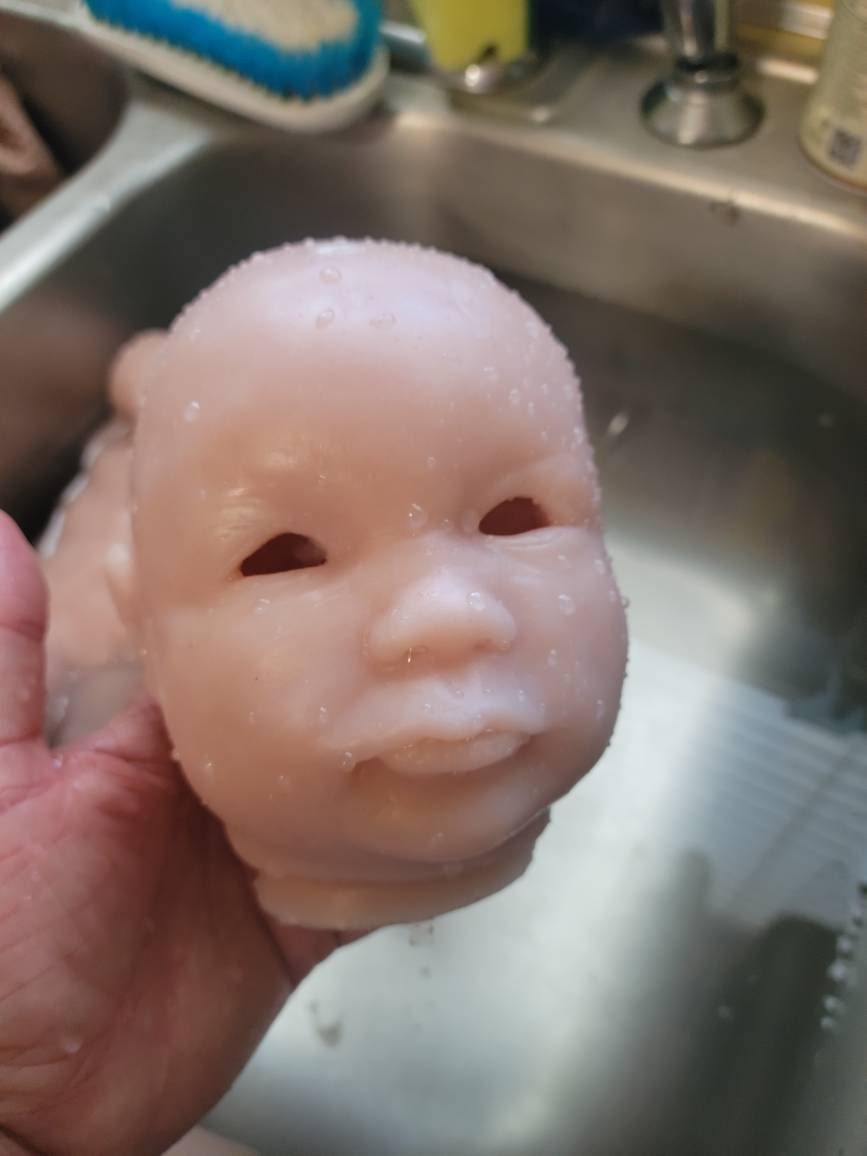 Silicone baby head for cuddle baby open eyes Donna kohn
