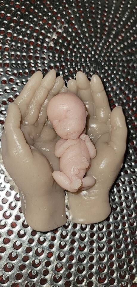 14 week gestation silicone memorial baby in silicone hands