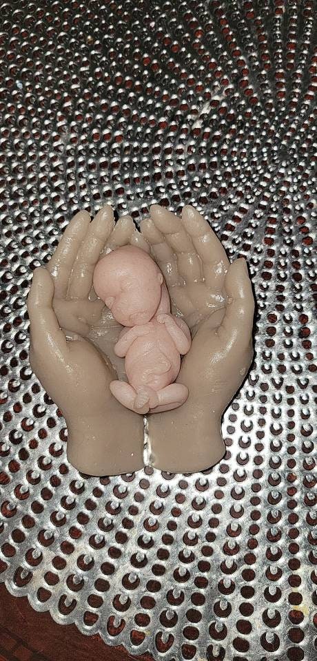 14 week gestation silicone memorial baby in silicone hands