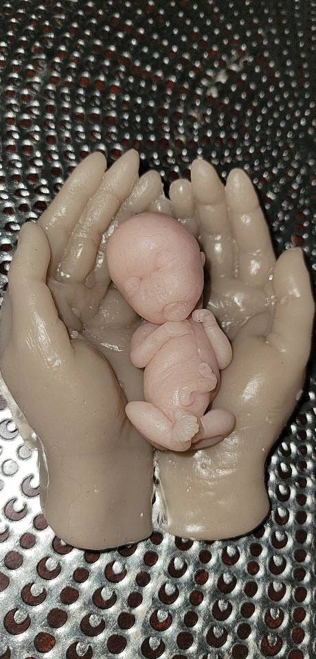 14 week gestation silicone memorial baby in silicone hands