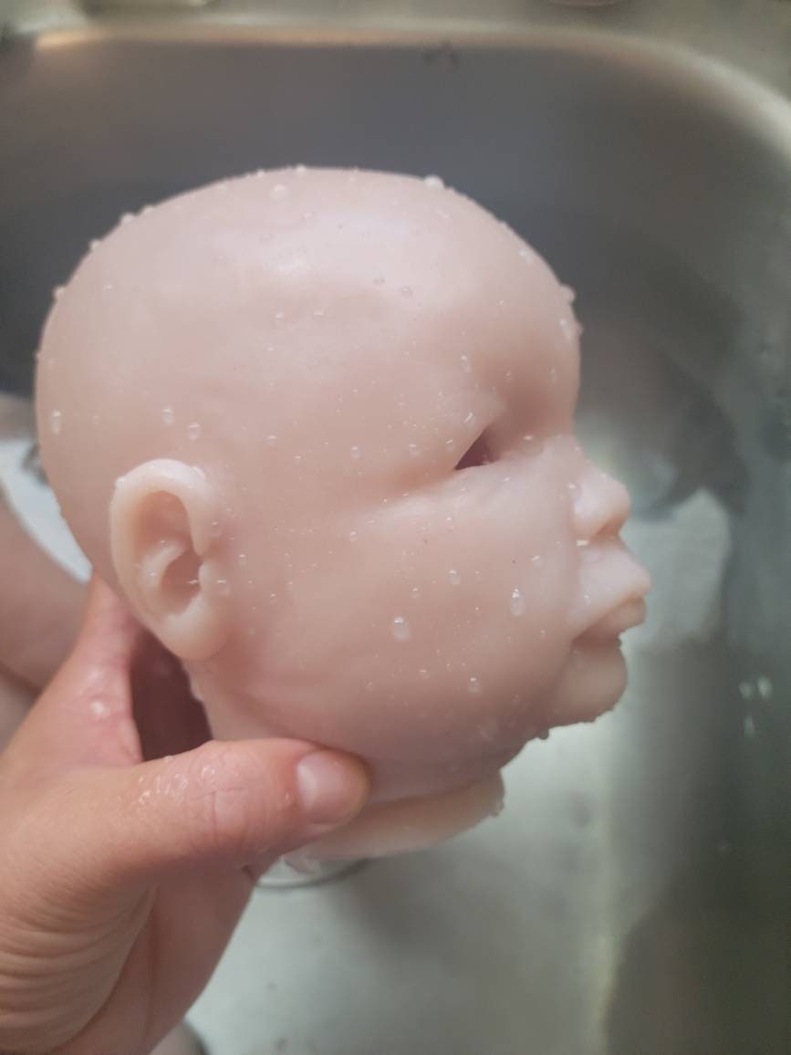 Silicone baby head for cuddle baby open eyes Donna kohn