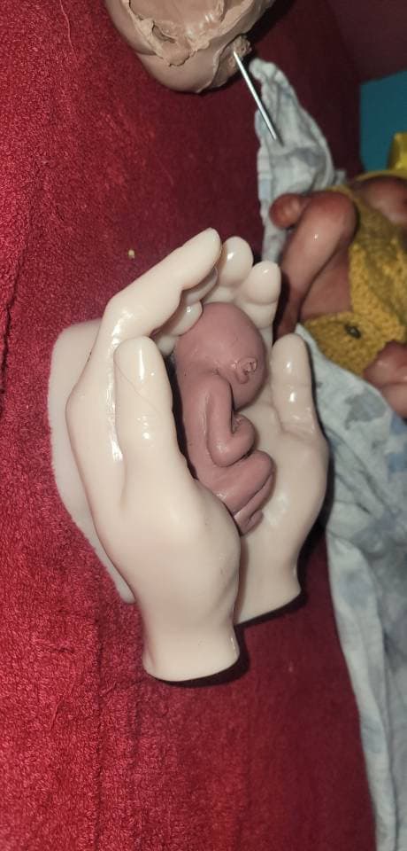 Life size silicone hands holding memorial silicone baby
