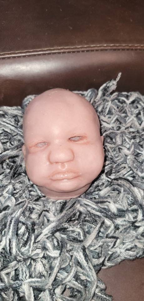 Silicone baby head by Donna kohn for 19" body