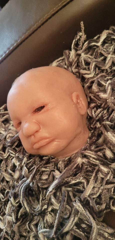 Silicone baby head by Donna kohn for 19" body