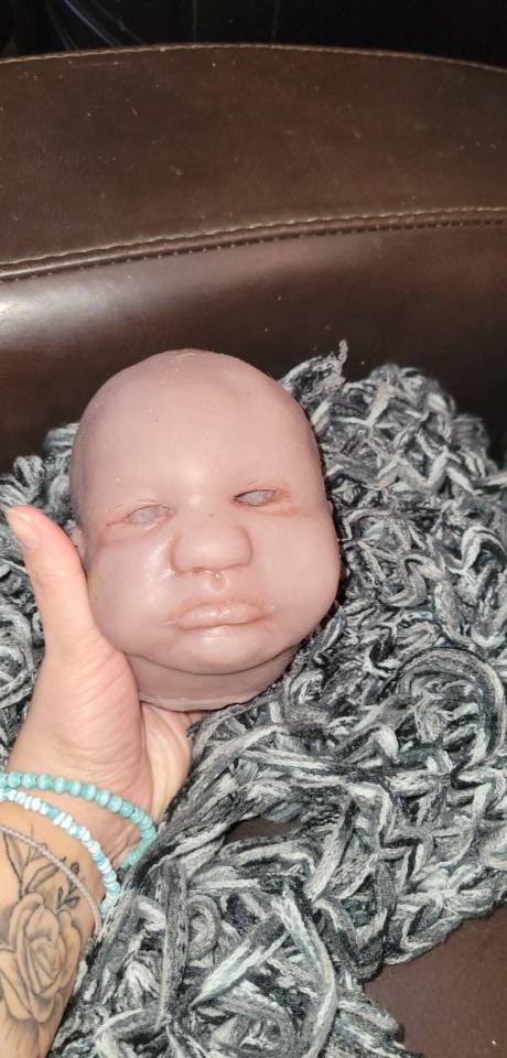Silicone baby head by Donna kohn for 19" body