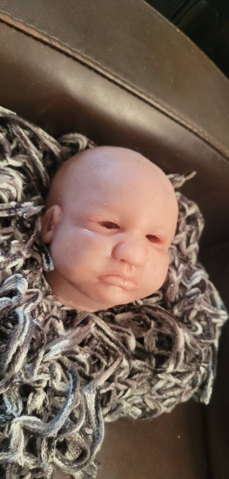 Silicone baby head by Donna kohn for 19" body