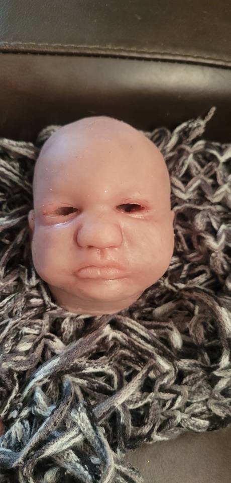 Silicone baby head by Donna kohn for 19" body
