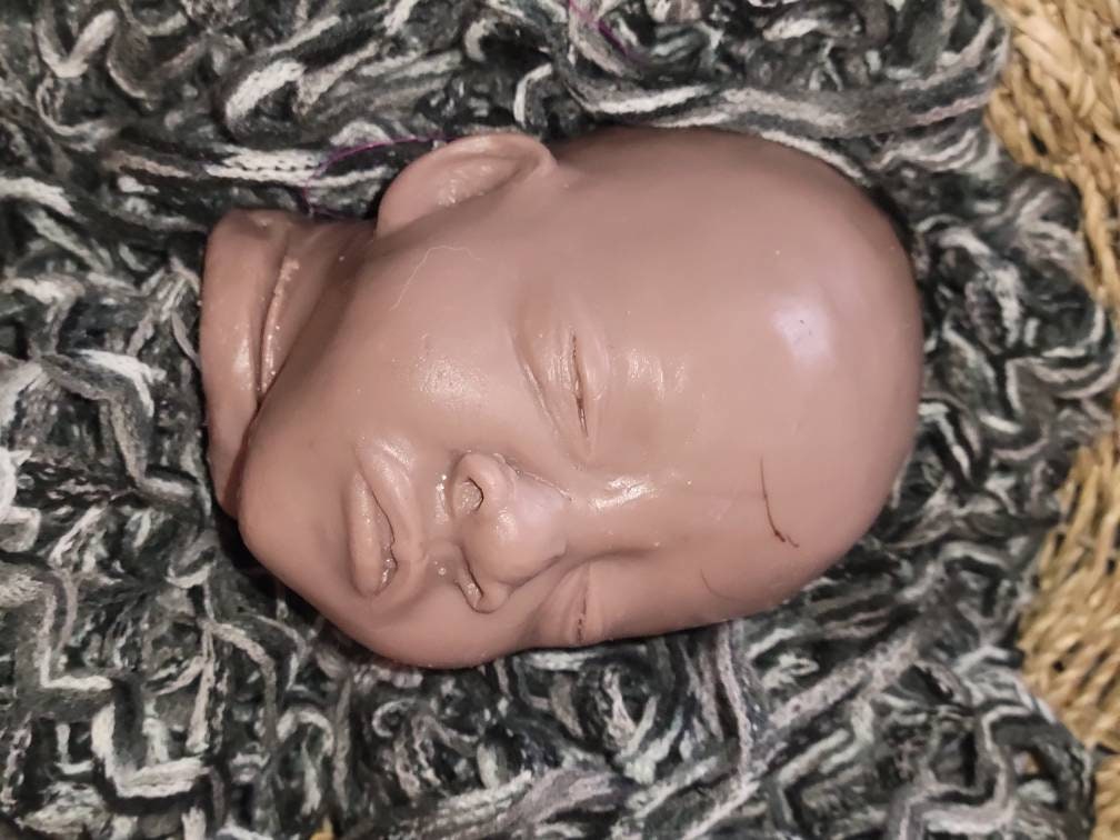 Silicone baby cuddle head by Michelle brier
