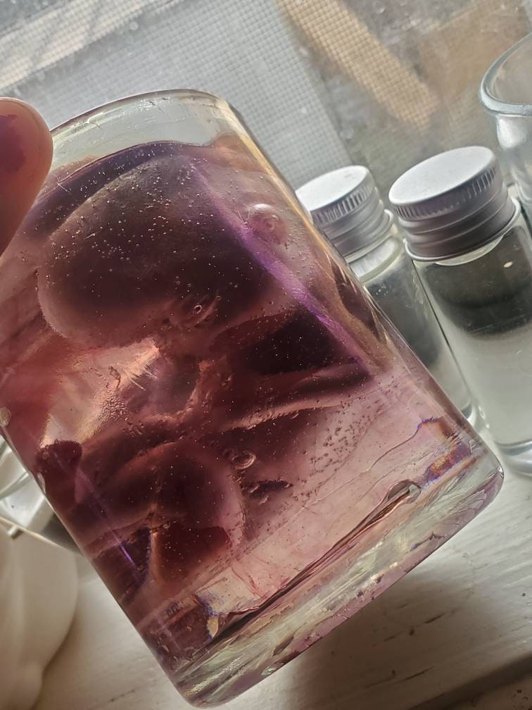 Memorial silicone fetus is glass jar with resin beautiful gift or for display