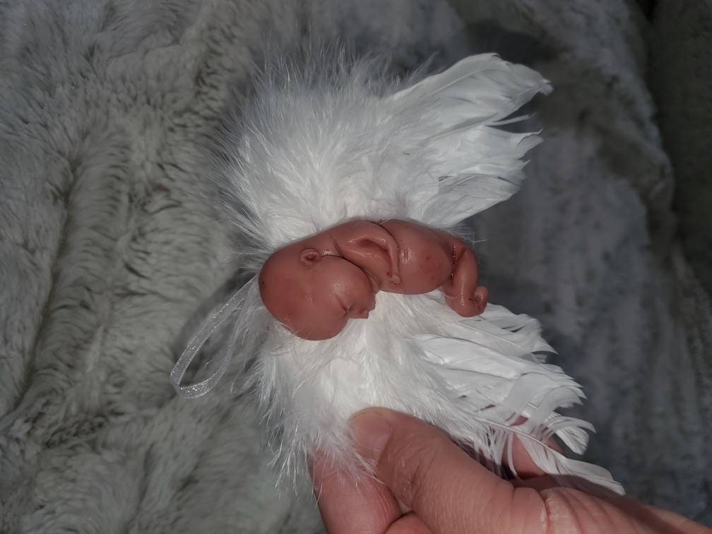 14 week gestation fetus memorial silicone baby fully painted with wings?