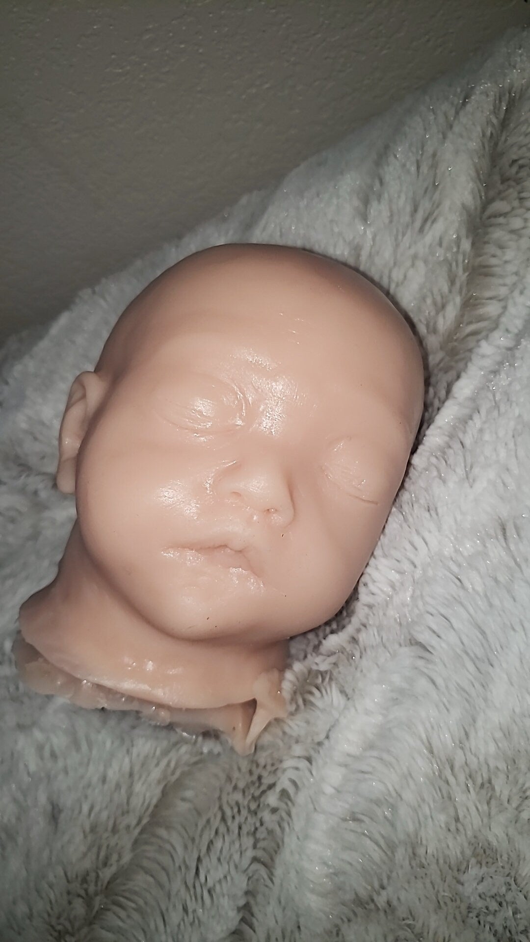 Silicone baby head for cuddle body