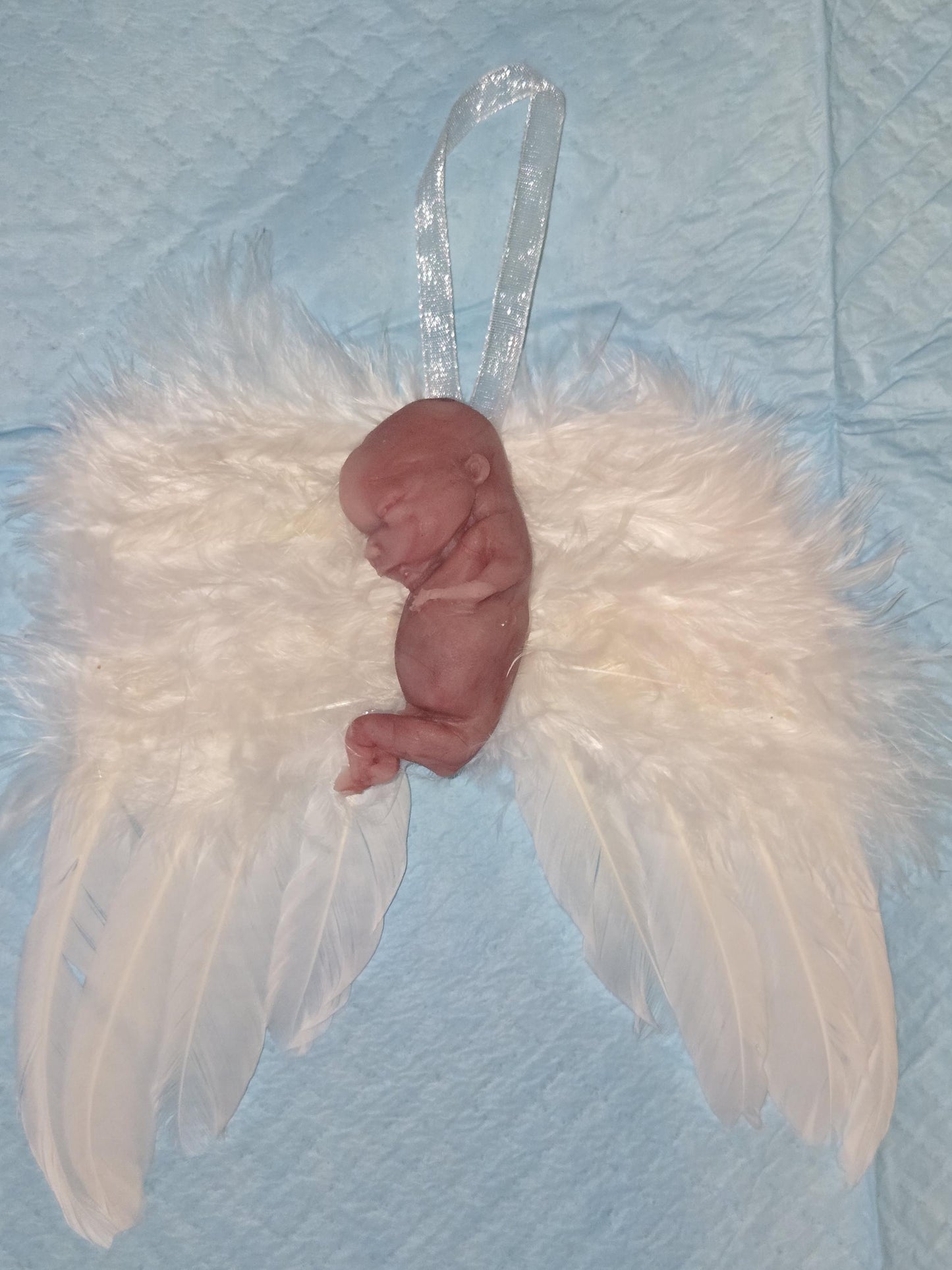 14 week gestation fetus memorial silicone baby fully painted with wings?