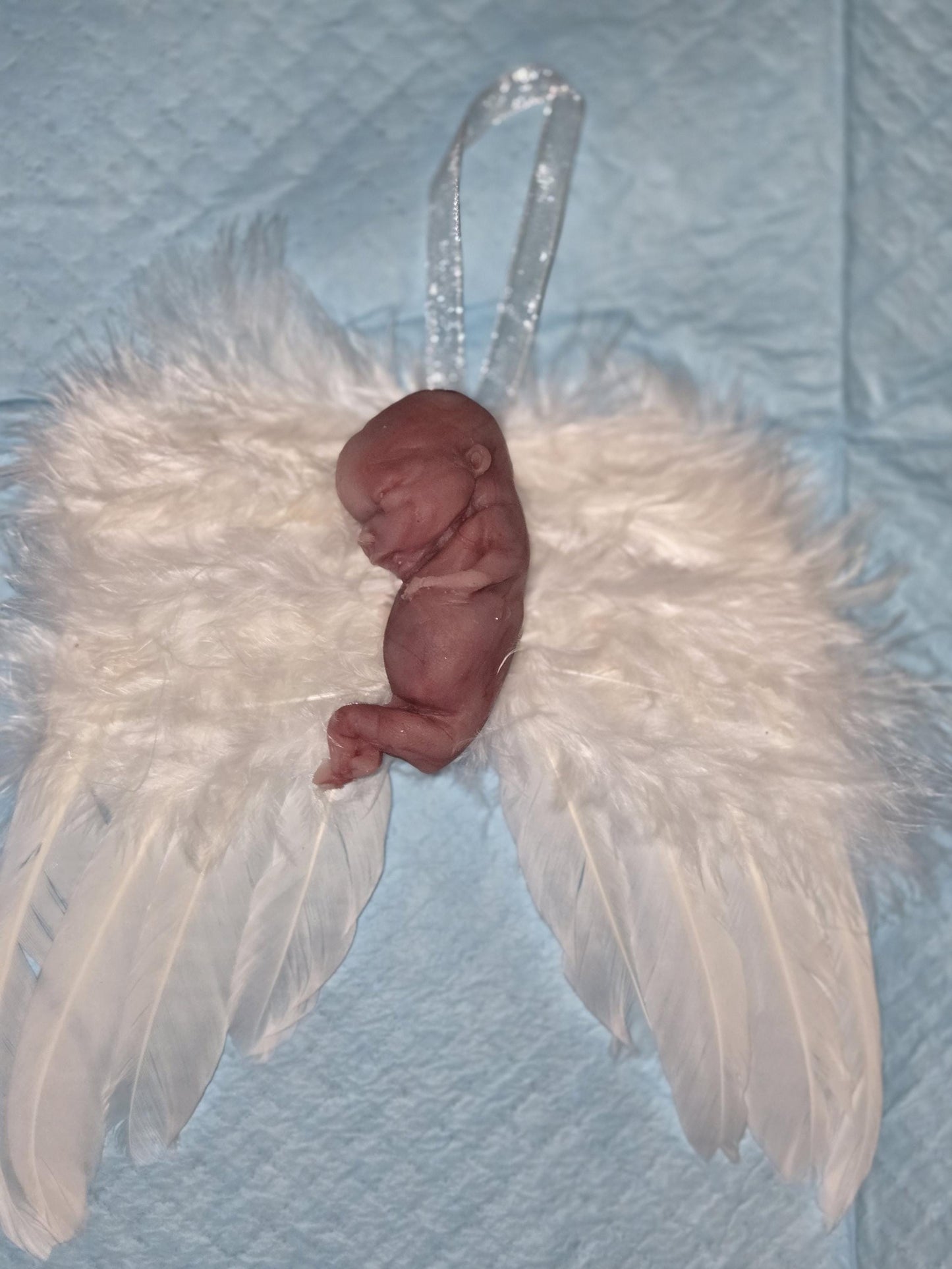 14 week gestation fetus memorial silicone baby fully painted with wings?
