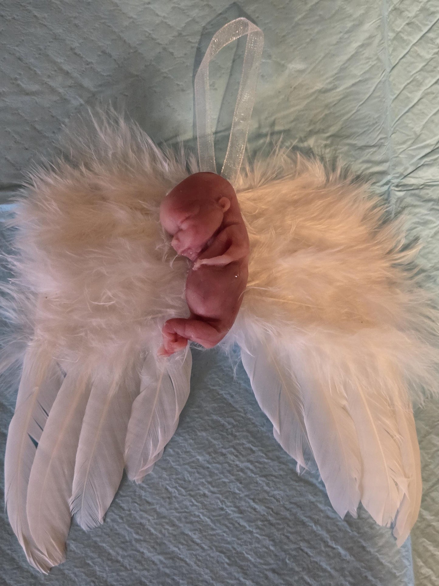 14 week gestation fetus memorial silicone baby fully painted with wings?